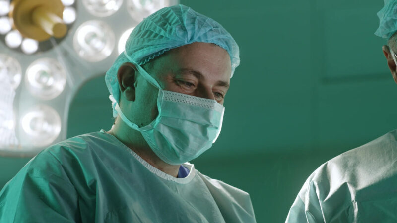 Specialist surgeon performs surgery