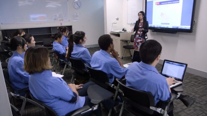 A Nursing Instructor Teaches a Group of Students in A Classroom Setting