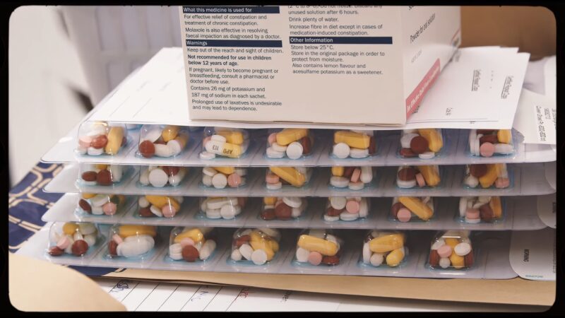 A Stack of Blister Packs Filled with Various Medications